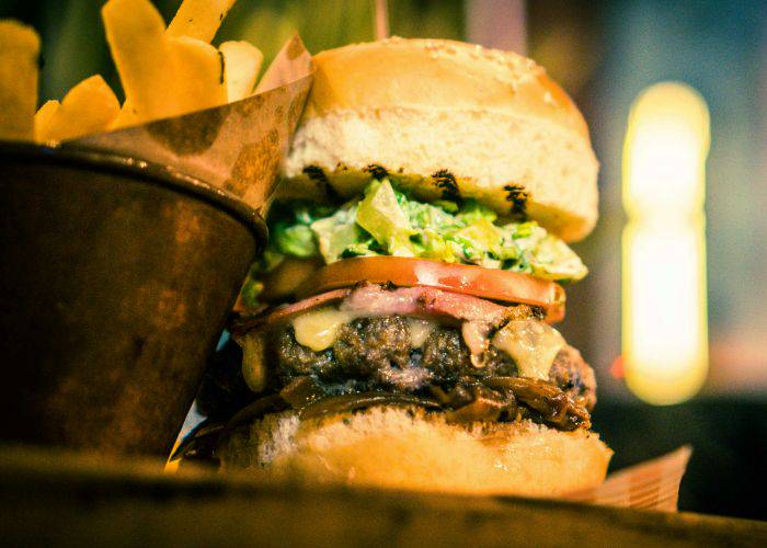 A juicy burger and a side of fries.