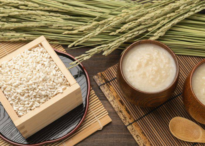 Koji rice next to cups of amazake and barley.