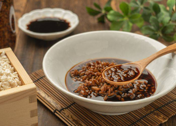 A bowl of koji used to create a flavorful seasoning.