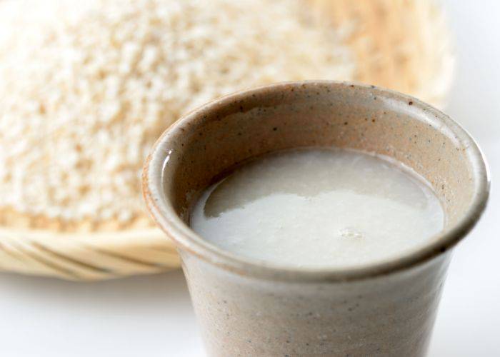 A cup of amazake, one of the uses of koji in Japan.