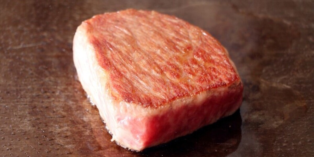Succulent Wagyu steak sizzling on a hot grill