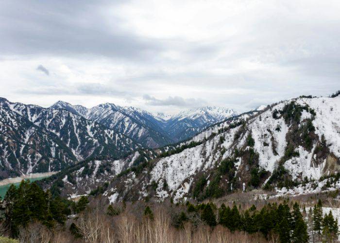 In this distance, the snow-capped mountains of the Tateyama Kurobe Alpine Route.