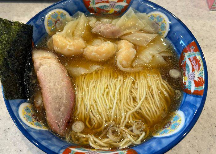 A classic bowl of ramen at Tantantei, featuring a thick broth and juicy cut of pork.