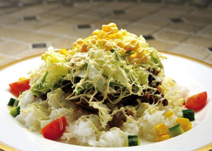 Saga's Sicilian rice dish, with a base of Japanese rice and layers of meat and vegetables, with a drizzle of mayo