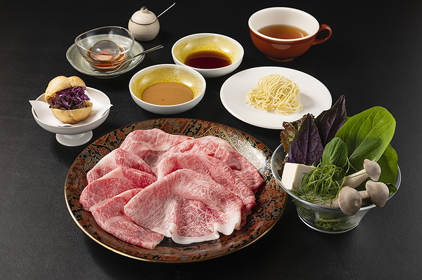 Wagyu beef slices with gourmet accompaniments at upscale restaurant