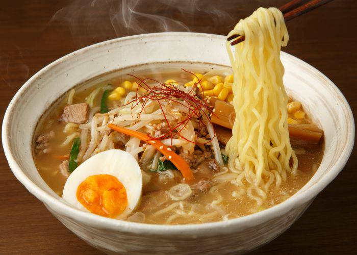 A bowl of classic Sapporo miso ramen, featuring delicious ingredients in a miso-based broth.