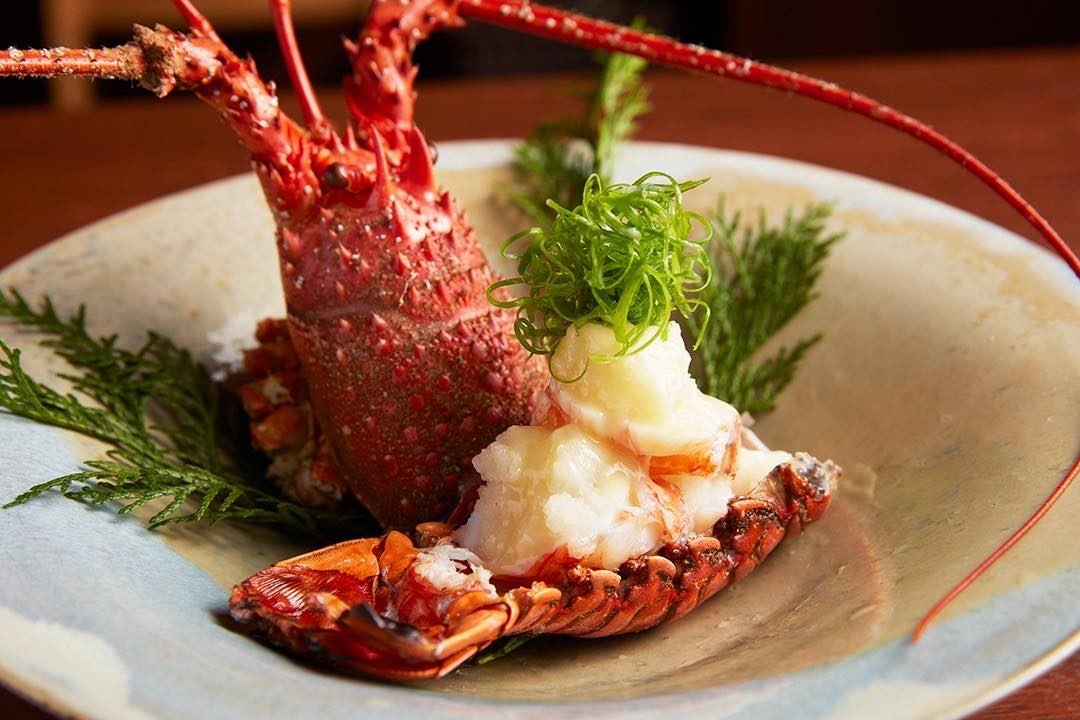 A premium lobster dish, featuring the head and meat-filled tail, at Imakoko.