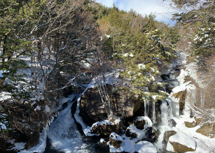 Ryuzu Waterfall covered in snow, during Nikko's iconic winter period.