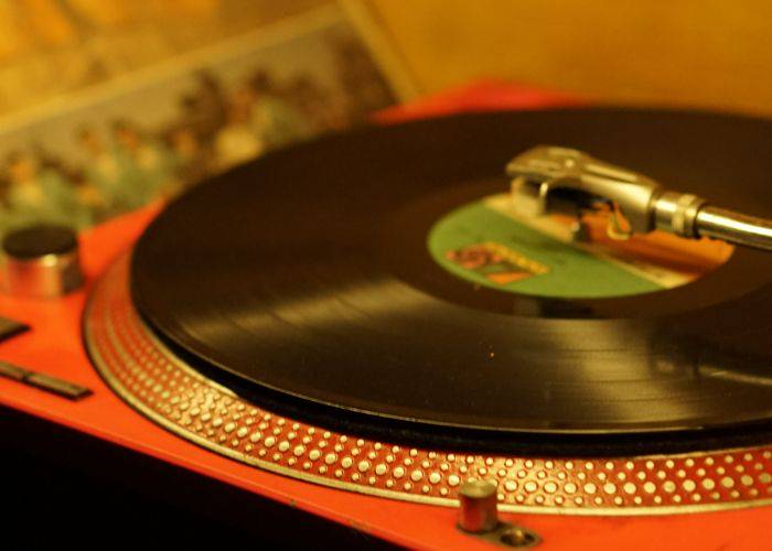 A vinyl record spinning on a record player.