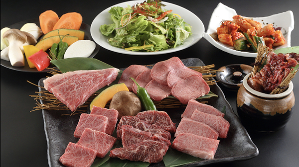 Exquisite gourmet dishes featuring fresh salads and premium meats.