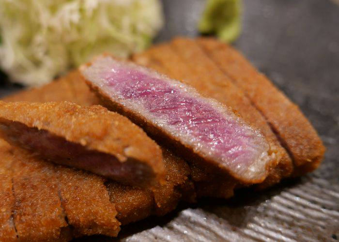 The popular beef cutlets served at Gyukatsu Motomura, still pink in the center.