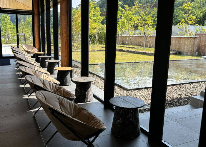 The relaxing interiors of Cafe noaddress, with chairs lined up against the window.