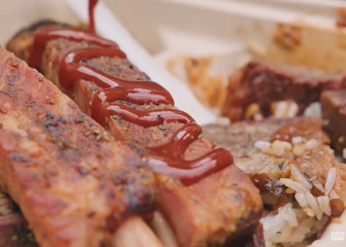 A close-up shot of the tender meats and spare ribs of SLICE of LIFE, covered in BBQ sauce.