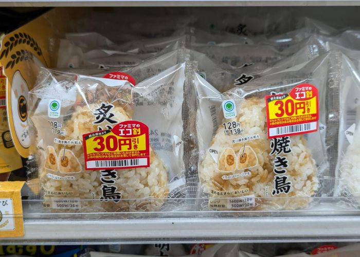 Chicken onigiri lining the shelves of a konbini.