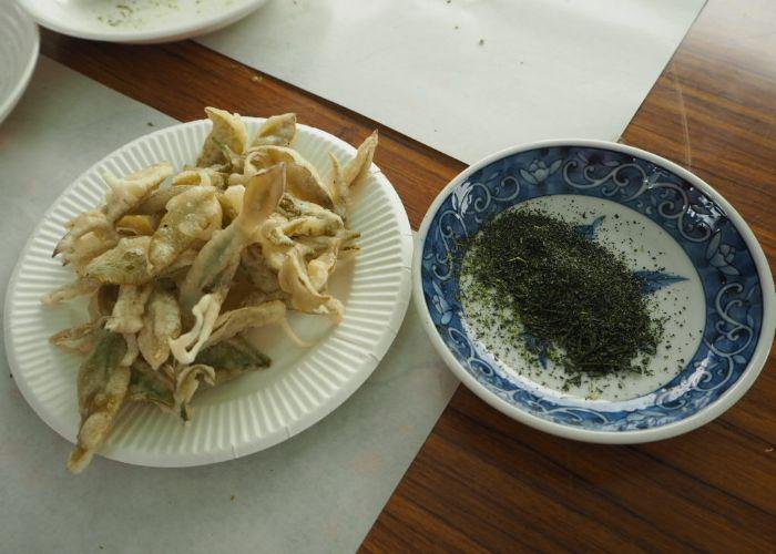 Tea leaf tempura and tea salt on a table