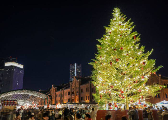 The beloved Yokohama Christmas Market, featuring a gigantic Christmas tree with a backdrop of their famous red-brick warehouses.