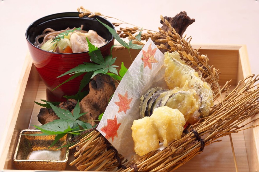 Exquisite Japanese tempura and soba noodle dish presented elegantly.