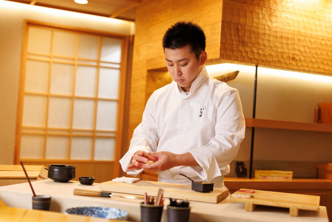 The inimitable chef of Sushi Inase rolling premium sushi by hand.