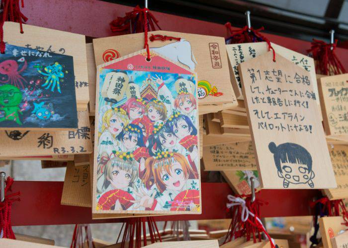 Love Live! illustrations on prayer blocks at Kanda Shrine.