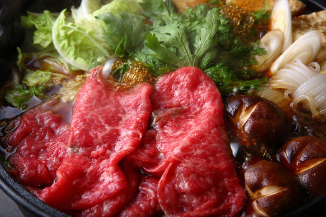 Halal meat being cooked up in a hot pot at Halal Sukiyaki Restaurant Diyafa.