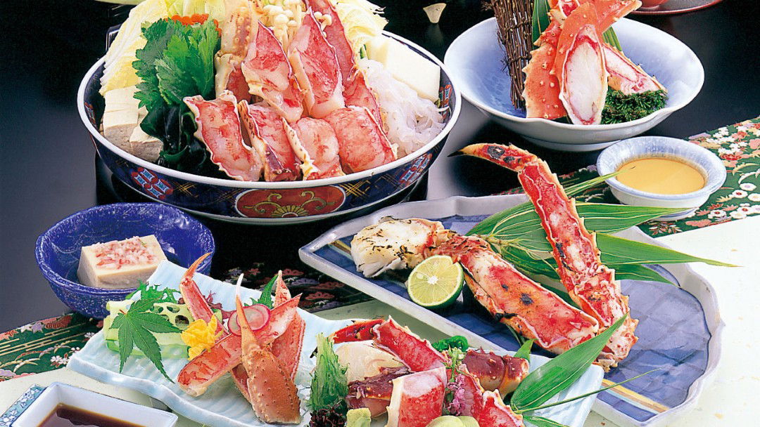 Exquisite Japanese seafood course with crab and fresh vegetables