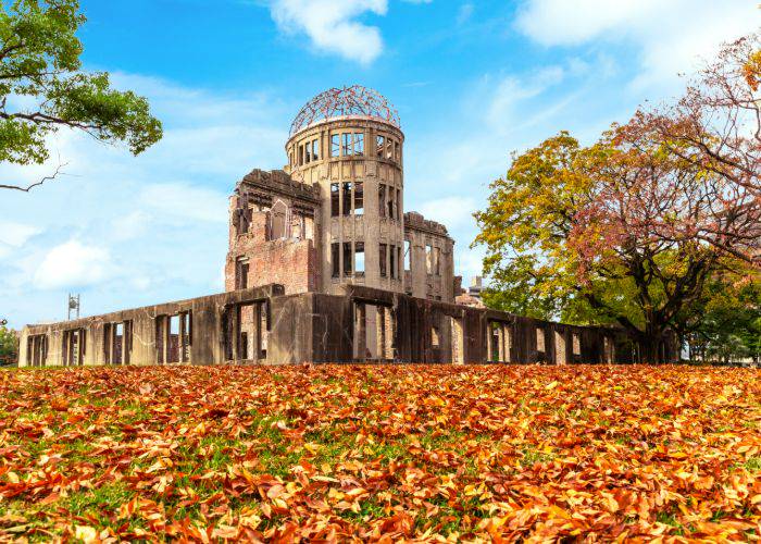 Hiroshima Memorial Dome, surrounded by fall foliage.