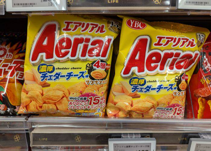 Bags of cheddar cheese flavored Aerial chips on the store shelf