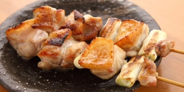 Grilled Chicken Skewers on Rustic Plate