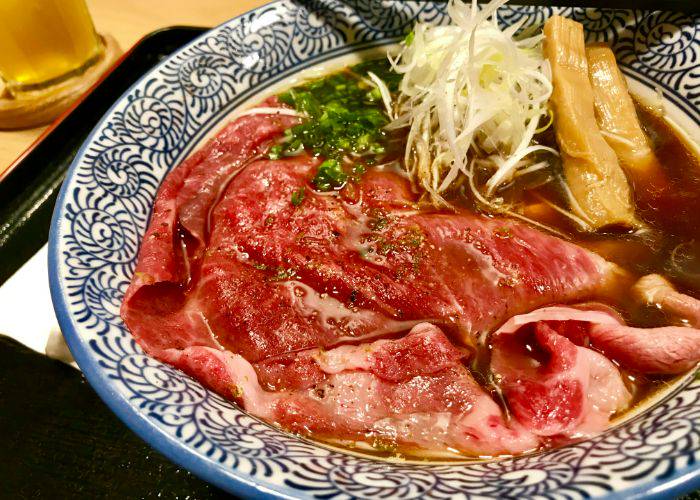 A luxurious bowl of ramen, generously filled with wagyu beef.