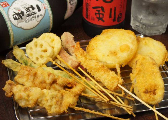 A selection of deep-fried kushikatsu skewers.