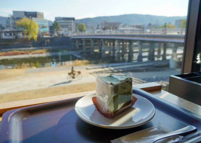 Looking out the window of a Kyoto cafe, overlooking the Kamo River.