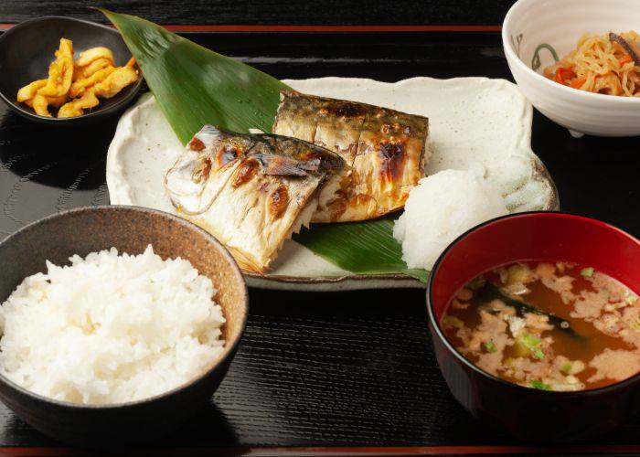 A Japanese teishoku set meal, featuring grilled fish, miso soup, rice and more.