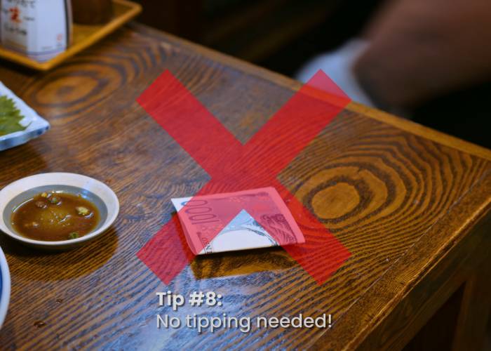 A cross over yen in a Japanese izakaya, representing no tipping in Japan.