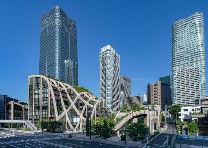 The striking architecture and lush greens of Azabudai Hills.