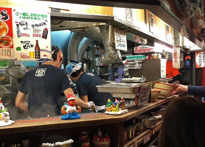 The lively kitchen and counter seating of Kyushu Jangara Ramen.