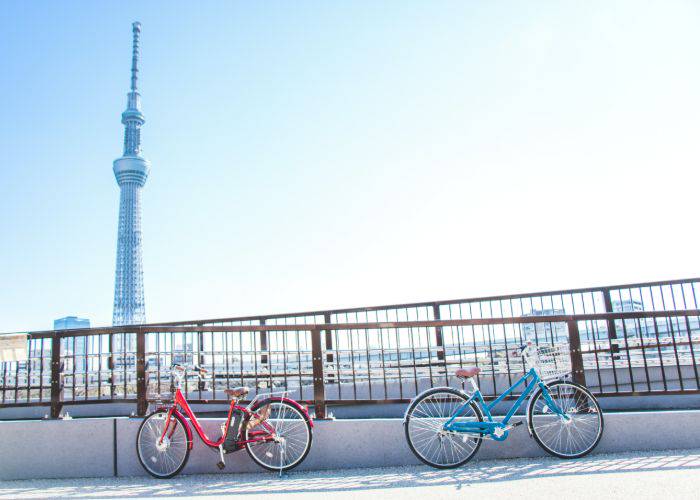 Two bikes parked by a viewing spot of Tokyo Skytree.