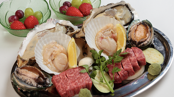 Gourmet seafood and steak platter at upscale restaurant