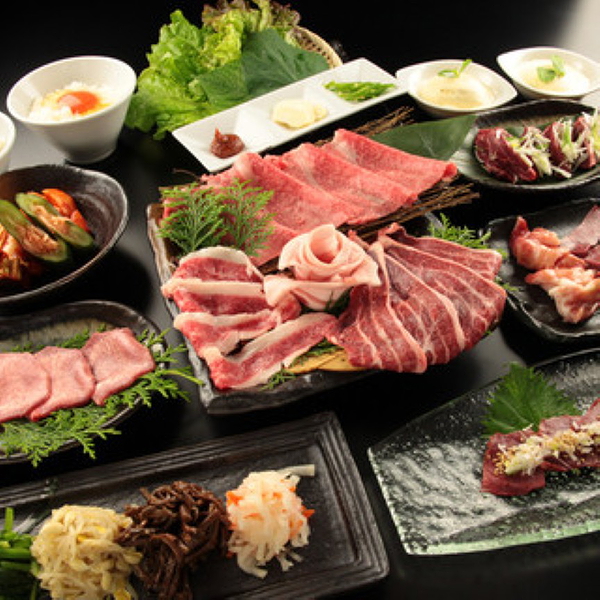 Upscale restaurant meat platter with fresh vegetables and sides