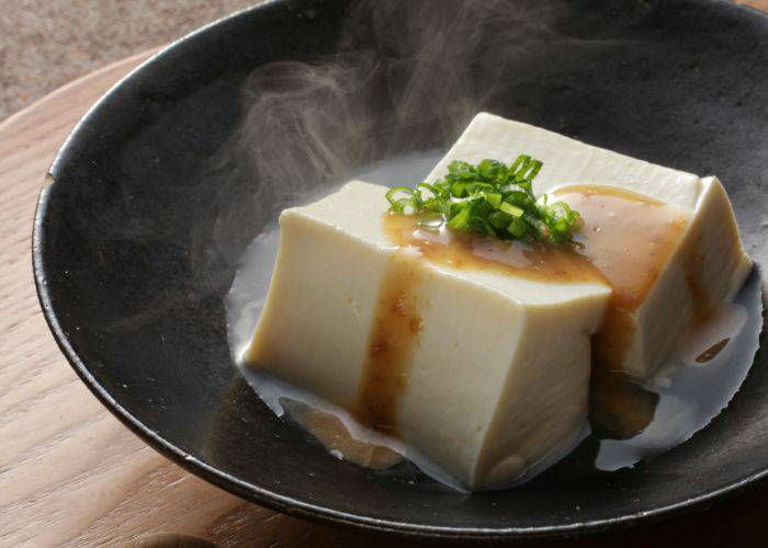 A bowl of tofu in a hot broth, known as yudofu.