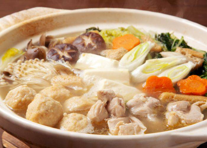 Japanese winter food: Nabe, featuring a broth filled with meats, tofu, veggies and more.