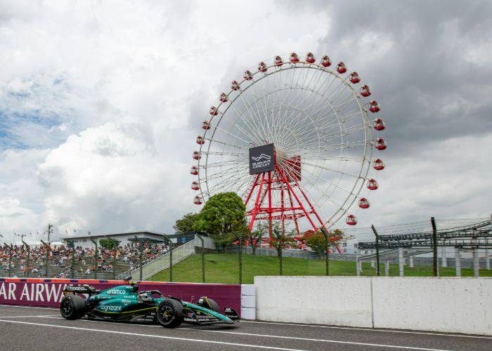 The jewel of the Japanese Grand Prix: the Suzuka Circuit, featuring an F1 car passing by a Ferris wheel.