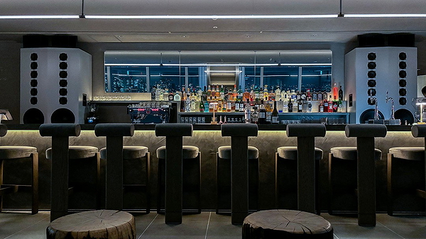Modern restaurant bar with city skyline view at night