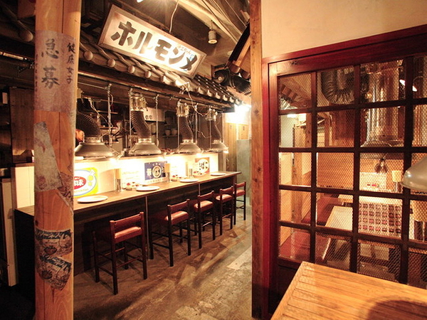 Cozy Japanese restaurant interior with wooden decor and warm lighting