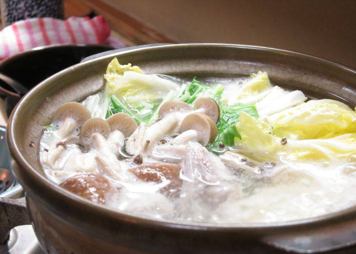 A bubbling fugu hot pot of puffer fish, mushrooms, cabbage and more.