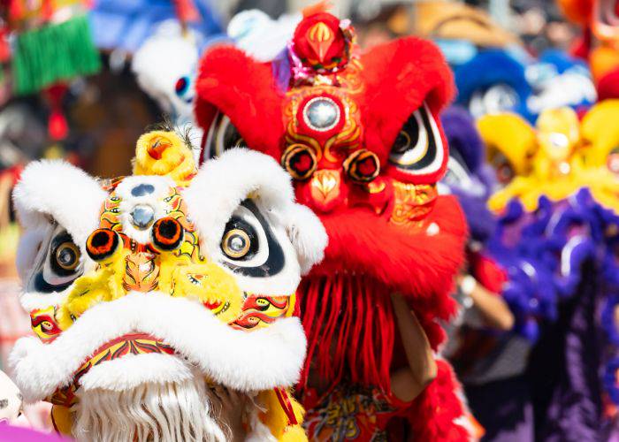 A parade for Lunar New Year in which people dress up as dragons.