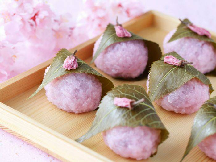 Sakura mochi, wrapped in a sakura leaf and decorated with sakura petals.