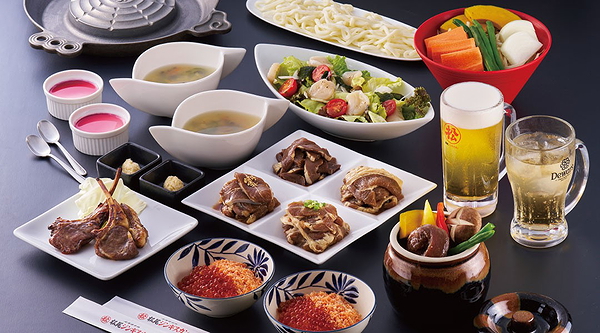 Delicious Japanese feast with sushi, salad, and drinks