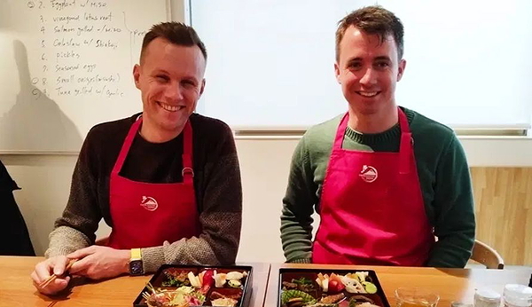 Two people enjoying a Japanese cooking class experience
