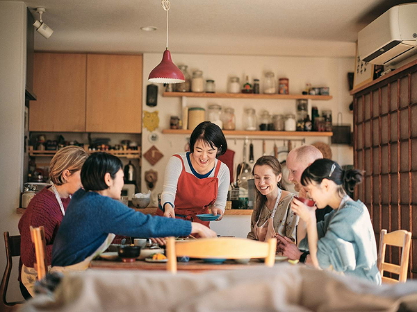 Family enjoying dinner together in a cozy kitchen setting
