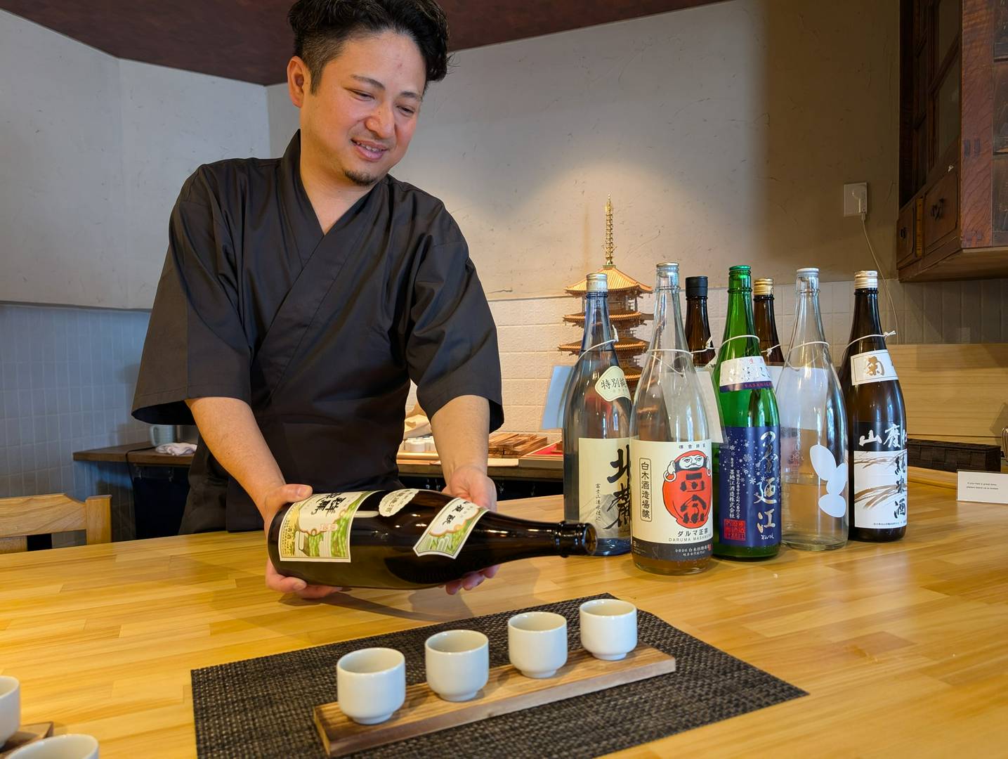 Man serving sake in a Japanese tasting experience
